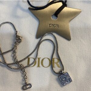 SOLD —Authentic Dior Trattor reversible necklace with dust bag and star